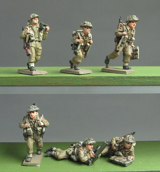 2-inch mortar teams moving and firing